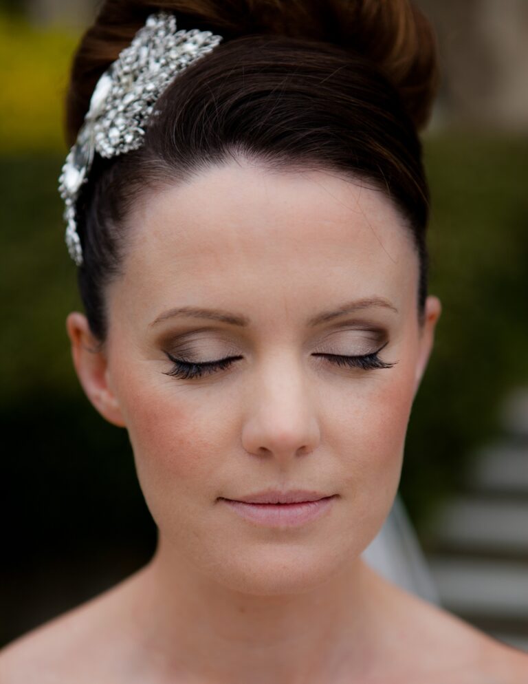 A close bridal portrait, jewelled hairpin and swept-up hair, Nadine Pyke Make Up Artist