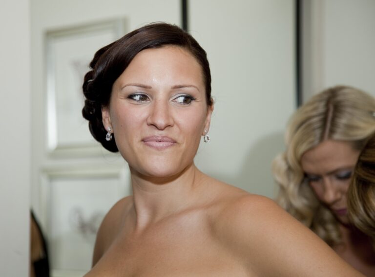 A bridal portrait, sleek low bun and drop earrings, Nadine Pyke Make Up Artist