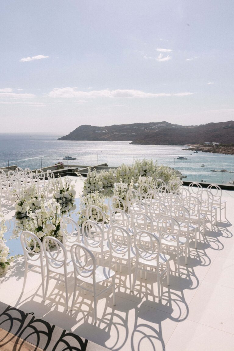 Rows of white chairs with a sea view, Naido Wedding