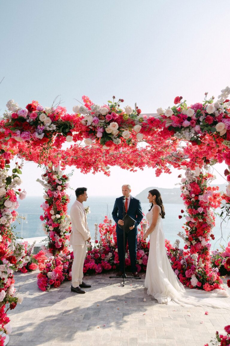 Wedding ceremony under a crimson floral canopy, Naido Wedding