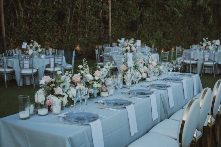 Long table in pale blue with peach and white flowers, Naido Wedding