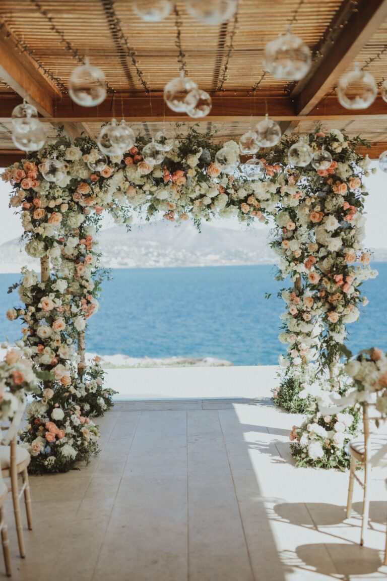 Flower-covered pergola framing the sea view, Naido Wedding