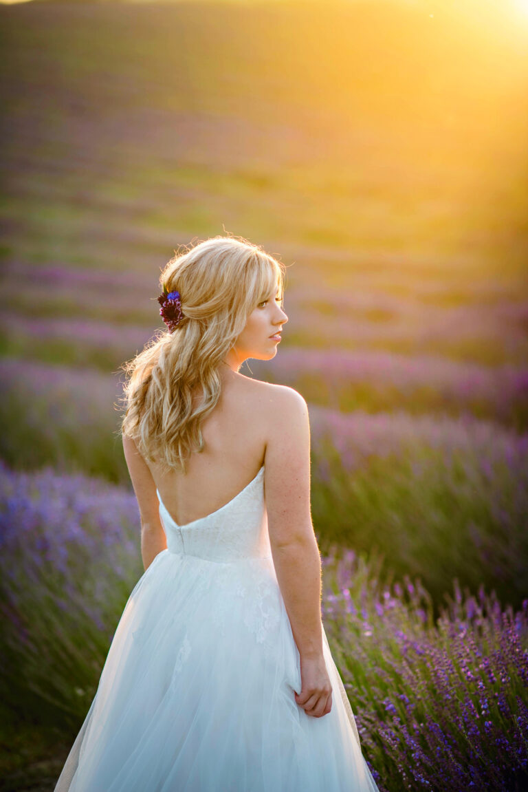 A bride in a Naomi Neoh gown at golden hour, Lavender Lust styled shoot