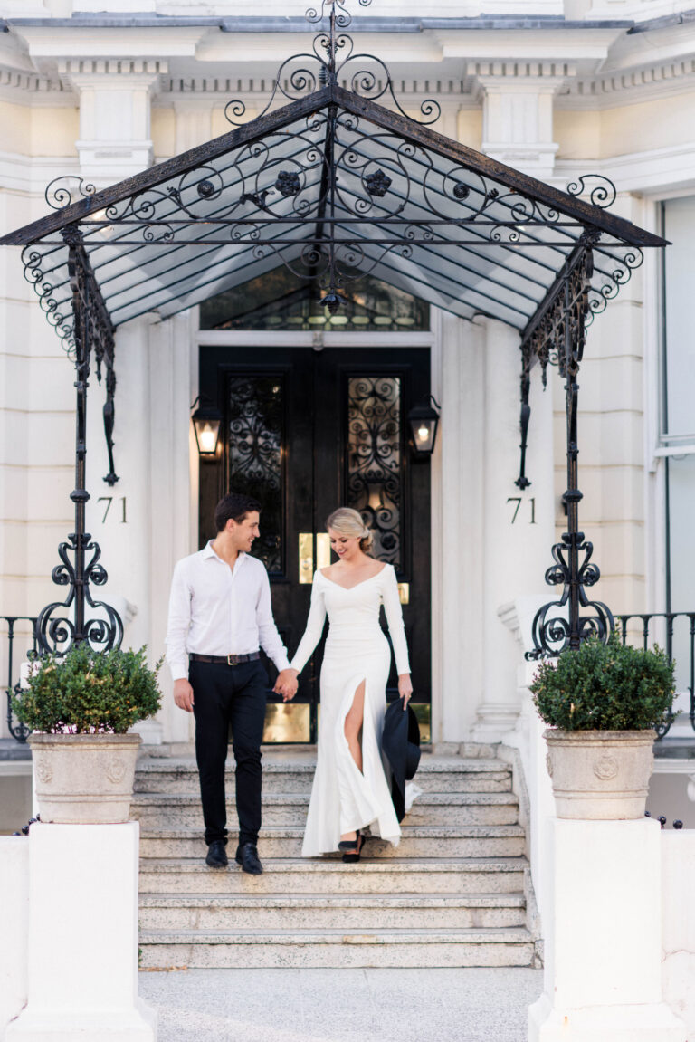 A couple on the steps of a London townhouse, the bride in a Naomi Neoh gown, Simply Divine styled shoot