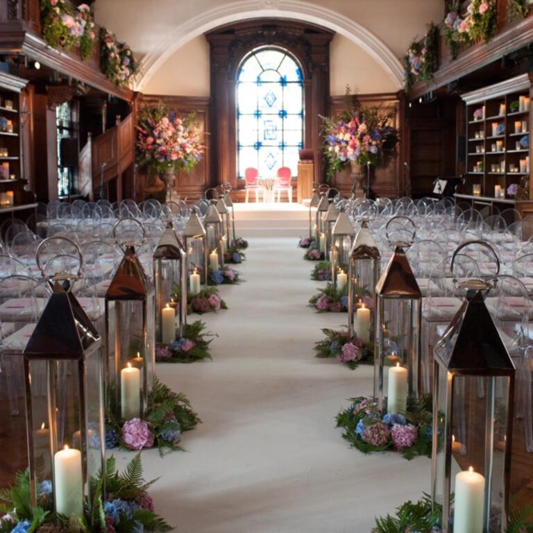 A ceremony aisle lined with lanterns and flowers at a Niemierko wedding