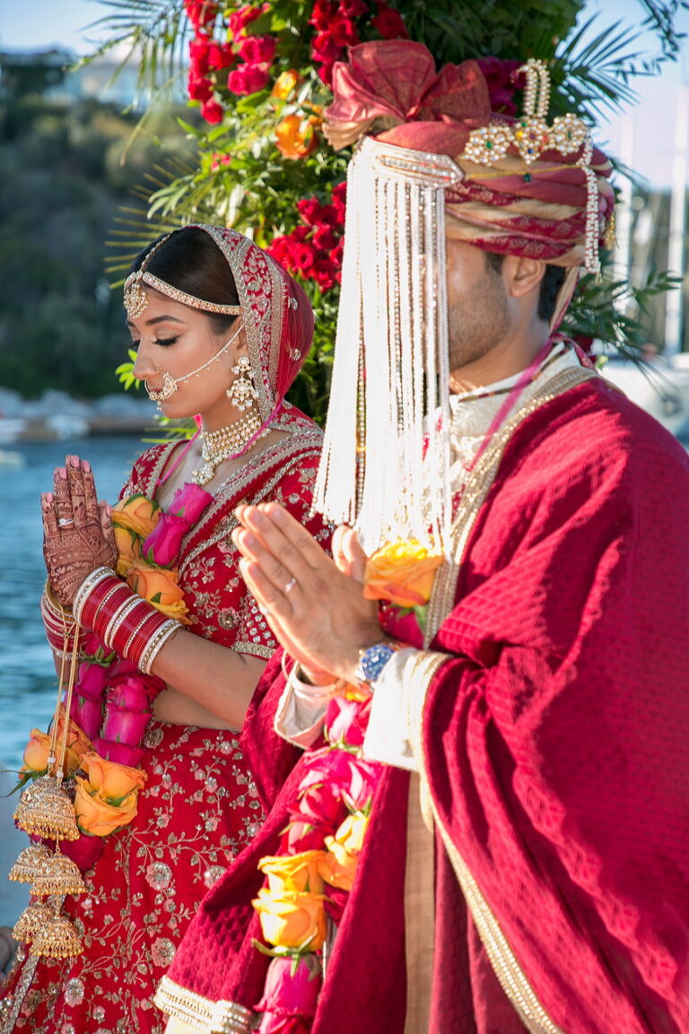 Couple with hands together in prayer during the wedding rituals, Nilyum Wedding and Event Design