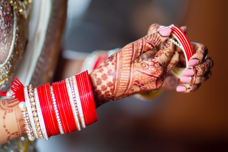 Mehndi and red bridal bangles close up, Nilyum Wedding and Event Design