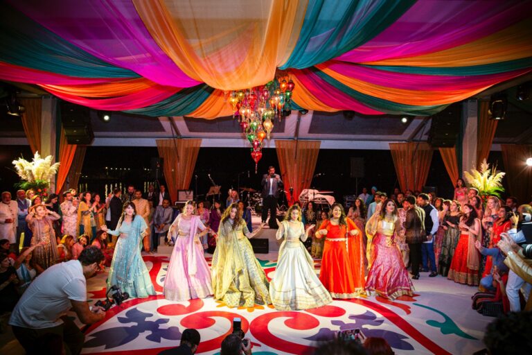 Sangeet dance floor beneath a canopy of coloured drapes, Nilyum Wedding and Event Design