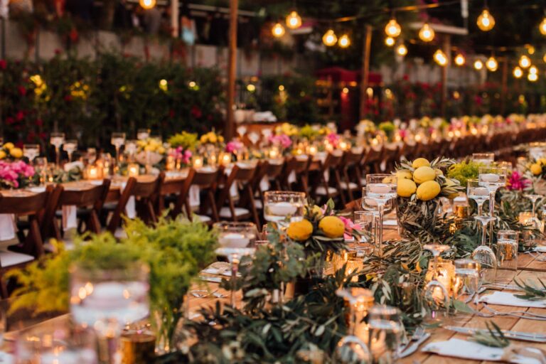 Evening banquet tables with lemons, foliage and warm festoon lighting, Nilyum Wedding and Event Design