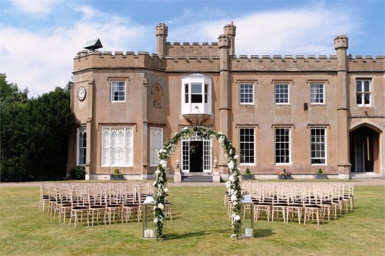 Ceremony chairs and a floral arch on the lawn before the north front, Non Such Mansion