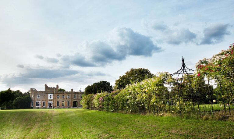 The mansion seen across the lawn and rose garden pergola, Non Such Mansion