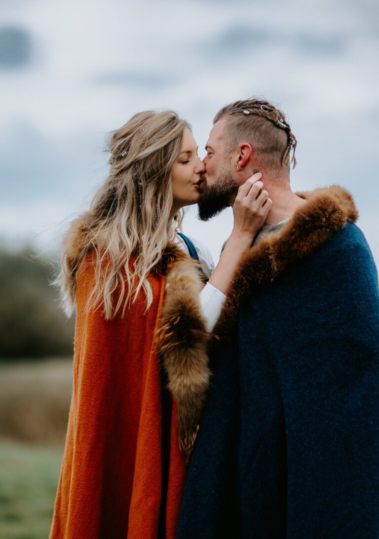 Couple in Viking costume sharing a kiss, Nordic Adventure Weddings