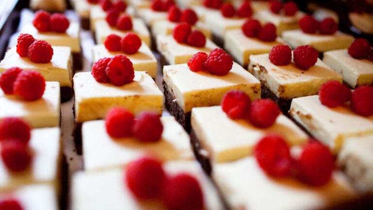 Rows of small cheesecake squares each topped with fresh raspberries, Northcote Manor Hotel