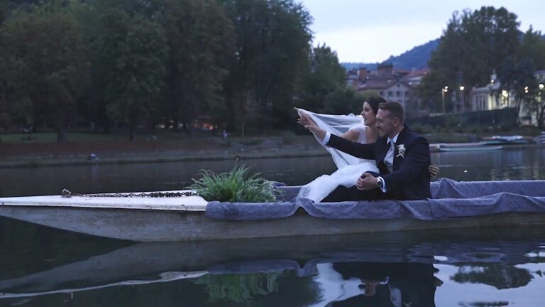 The couple in a flat boat on the water at dusk, from Giusy and Alessandro's trailer, Nozze da film