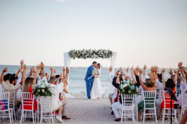 Guests seated at a beach ceremony, Nunta pe Plaja