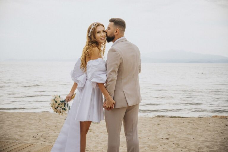 A couple on the beach at their wedding, Nunta pe Plaja