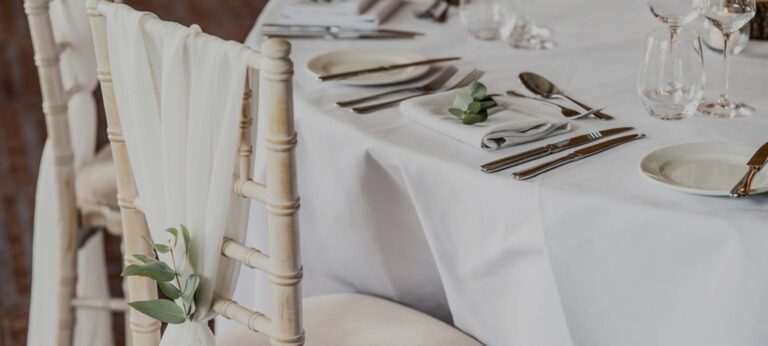 A place setting on a Chiavari chair, dressed for the wedding breakfast, Nutfield Priory Hotel & Spa