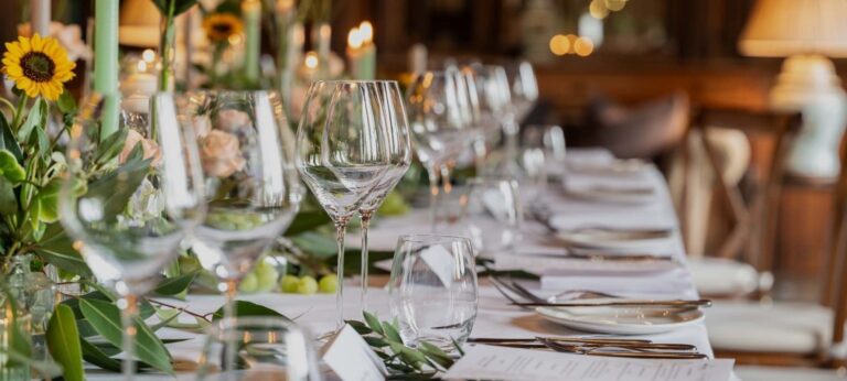 A wedding breakfast table dressed with sunflowers, glassware and greenery, Nutfield Priory Hotel & Spa