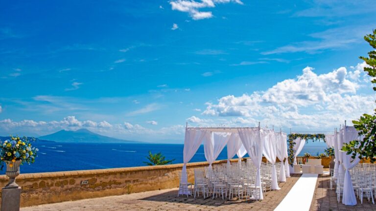 A ceremony on a clifftop terrace, Vesuvius across the Bay of Naples, O'Sarracino Events