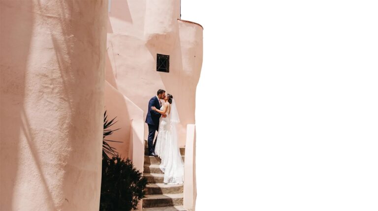 A stair between apricot walls, the couple in the shadow of the render, O'Sarracino Events