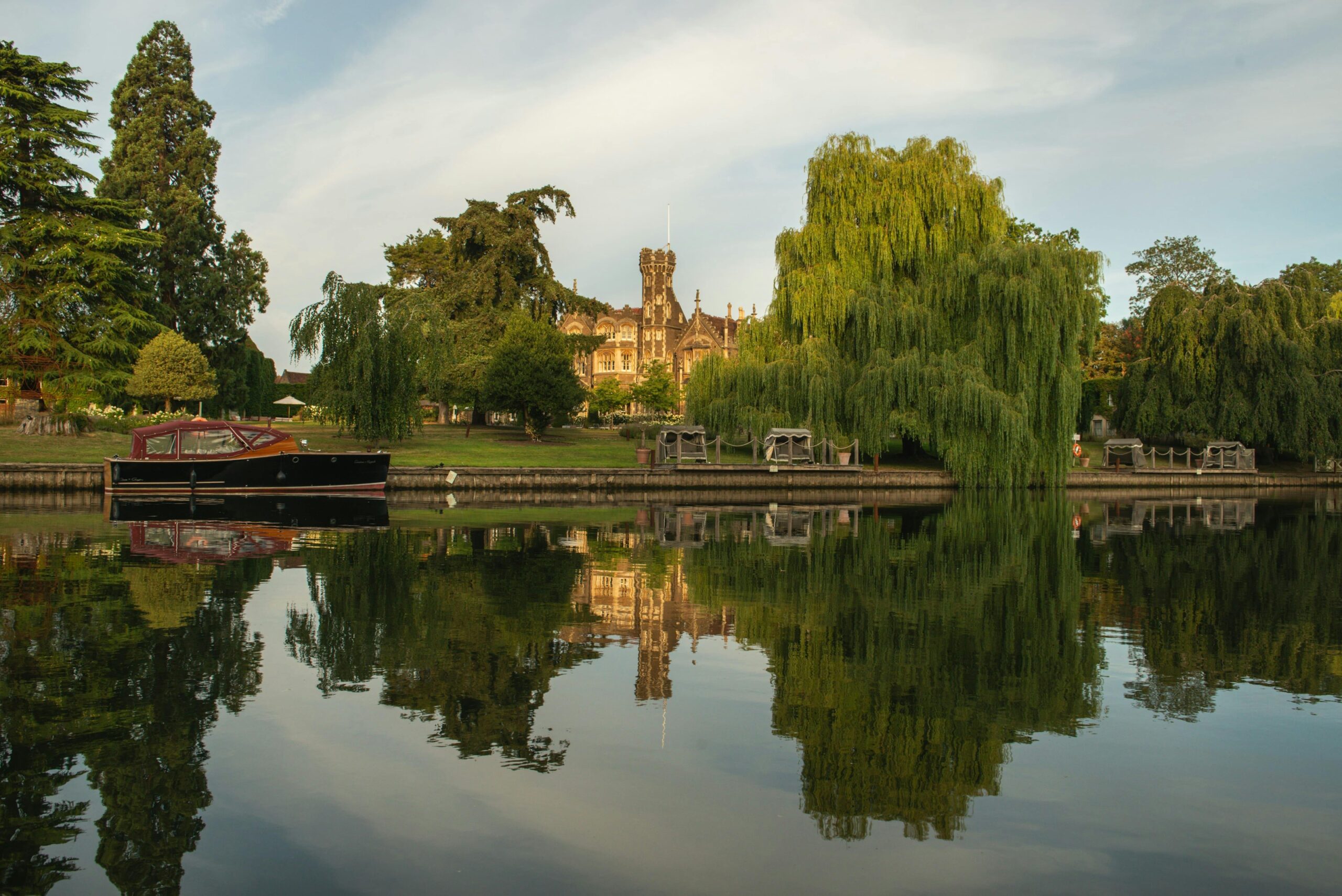The mansion house reflected in the River Thames, Oakley Court Hotel, Windsor
