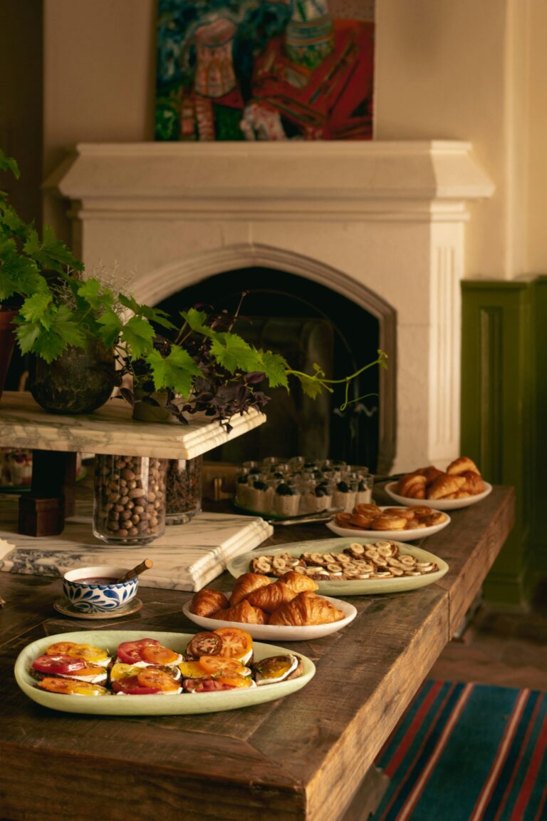 A buffet laid out beside a fireplace in the mansion, Oakley Court Hotel, Windsor