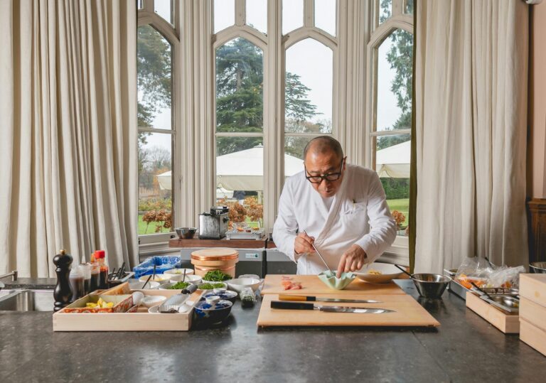 A guest chef preparing food in the Sitting Room, Oakley Court Hotel, Windsor