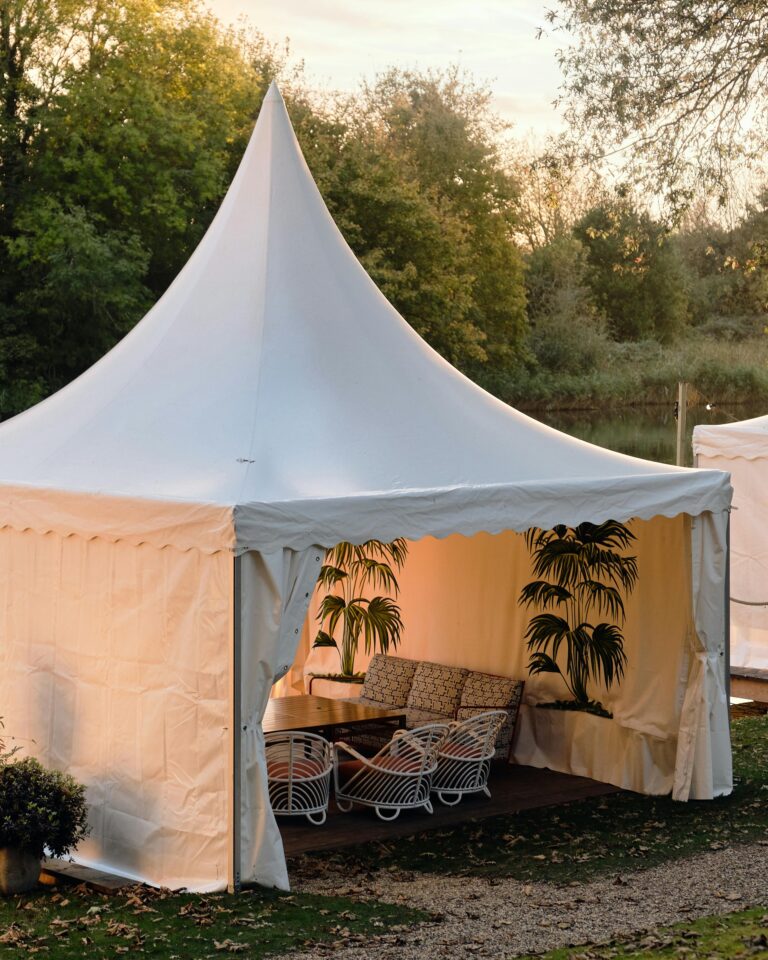 A white pavilion tent on the riverbank at River House, Oakley Court Hotel, Windsor