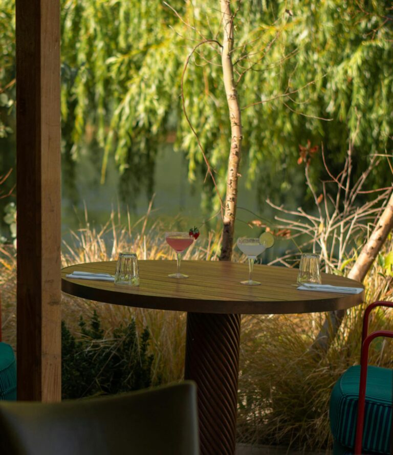 A table beneath a willow at River House, Oakley Court Hotel, Windsor