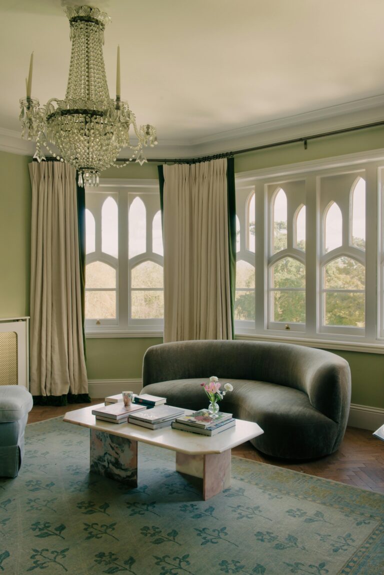 A mansion house lounge with a chandelier and Gothic windows, Oakley Court Hotel, Windsor