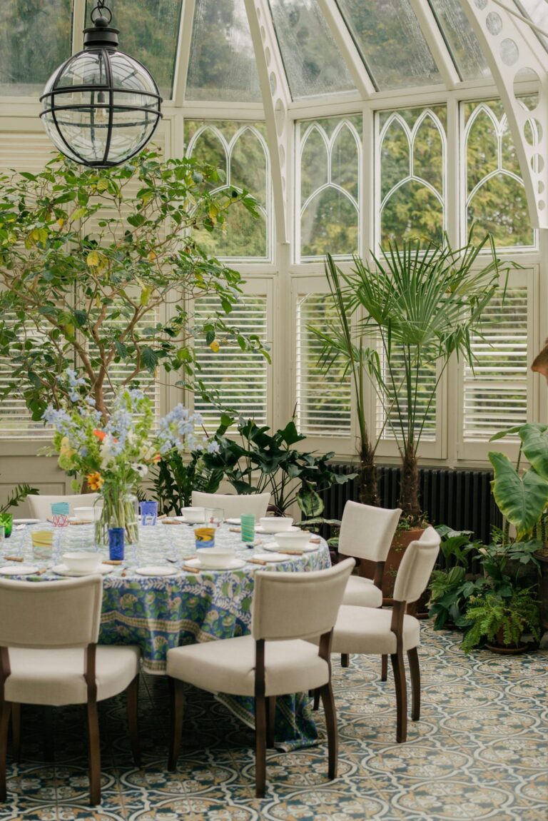 A conservatory set for dining beneath a glazed roof, Oakley Court Hotel, Windsor