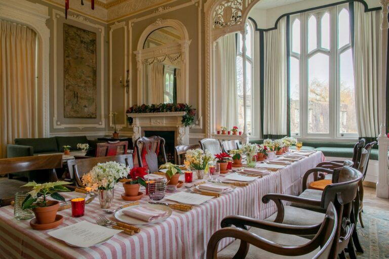 A long table laid for a celebration in a panelled mansion room, Oakley Court Hotel, Windsor
