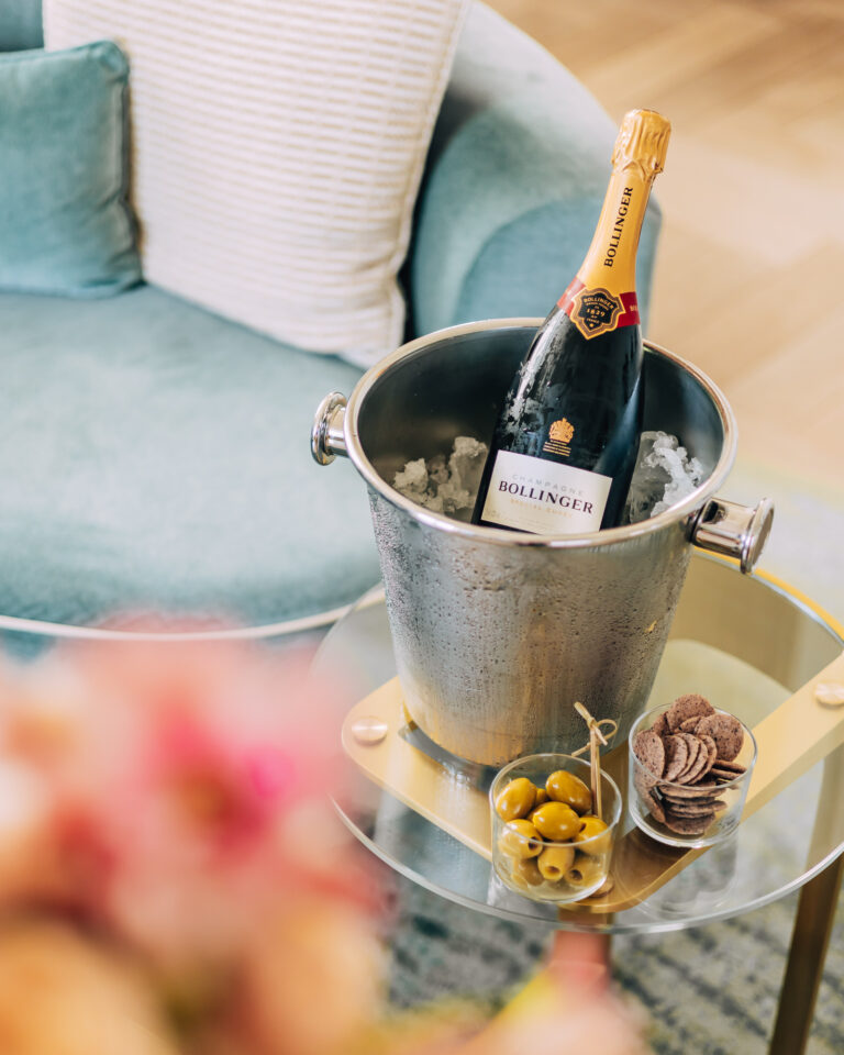 A bottle of Champagne on ice with olives, set out in a suite, One Aldwych