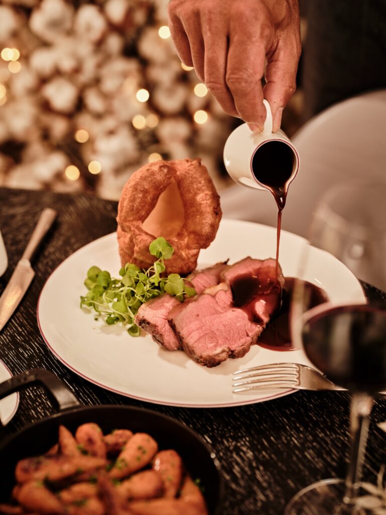 Roast beef with Yorkshire pudding and jus poured at the table, One Aldwych