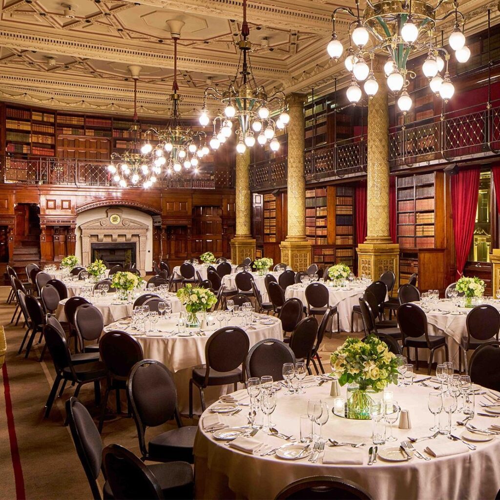 The Gladstone Library laid with round tables and chandeliers, One Whitehall Place