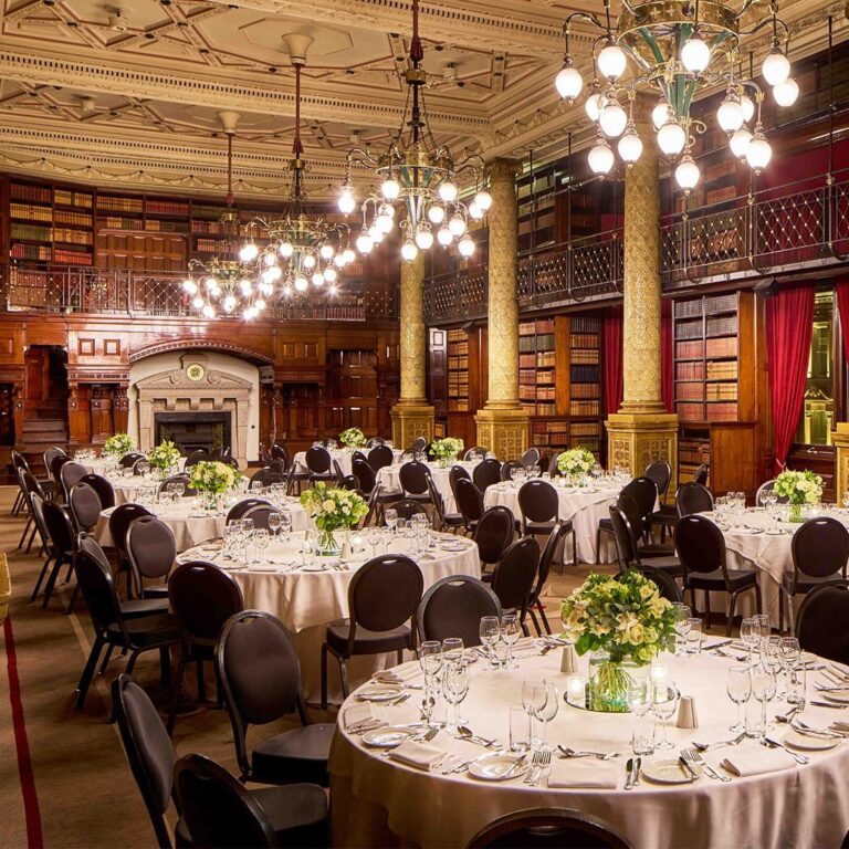 The Gladstone Library laid with round tables and chandeliers, One Whitehall Place