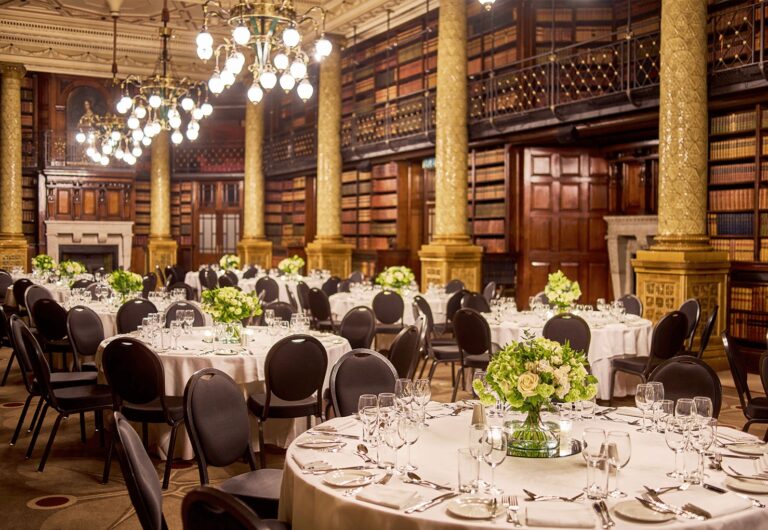 Round tables dressed with flowers in the Gladstone Library, One Whitehall Place