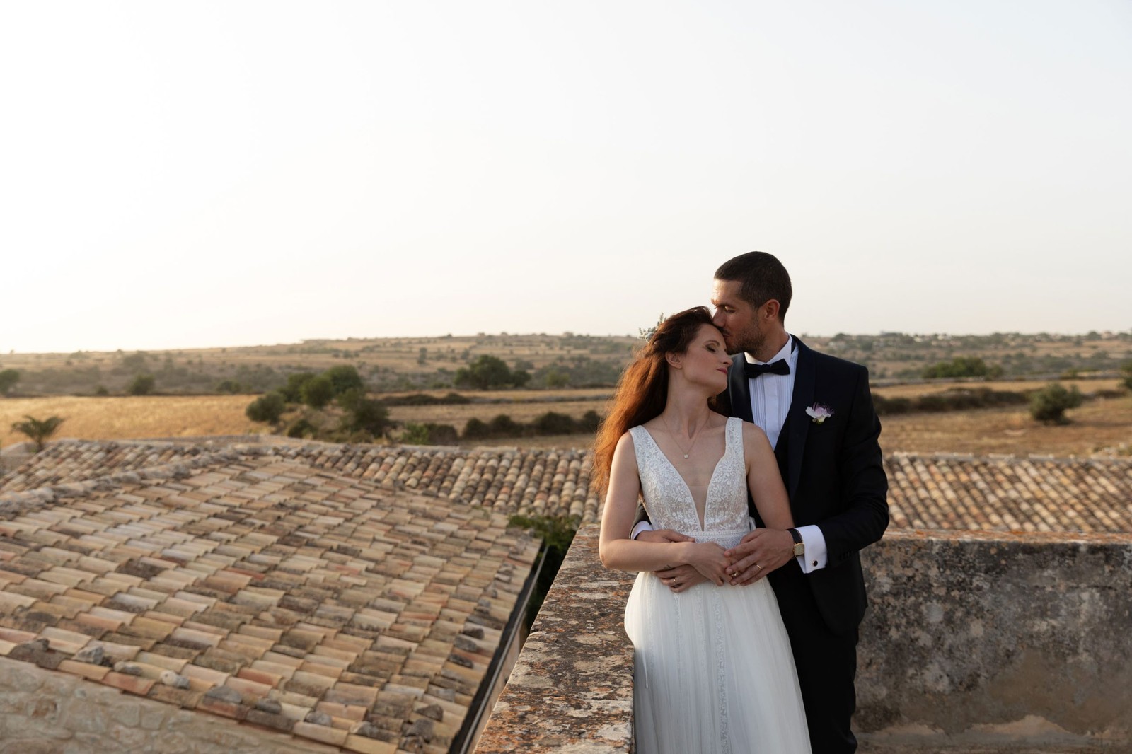 The couple on a rooftop terrace in the evening light, a family country house in Sicily, Ordine della Giarrettiera