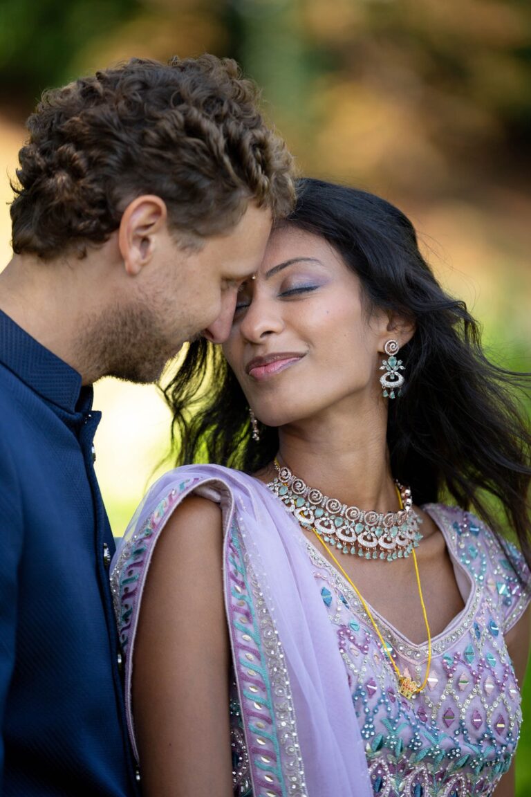 The couple forehead to forehead at their Hindu wedding in Como, Ordine della Giarrettiera