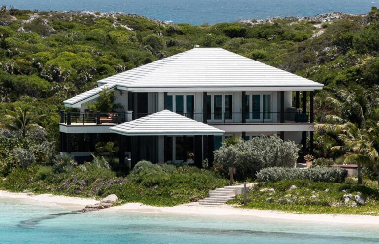 A villa set just above the beach, seen from the shore, Over Yonder Cay