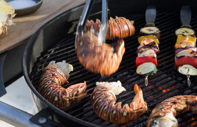 Grilled lobster tails and skewers on the barbecue, Over Yonder Cay