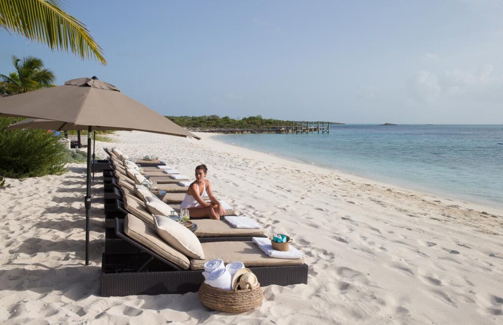 Sun loungers and parasols on the beach, Over Yonder Cay
