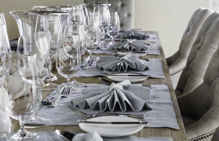 Dining table laid with glassware and linen napkins, Over Yonder Cay