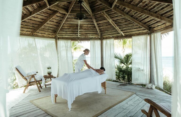 Spa cabana with a massage table open to the beach, Over Yonder Cay