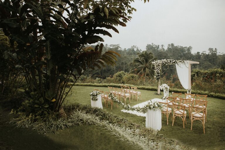 Ceremony aisle and arch laid out on the lawn, Padma Resort Ubud