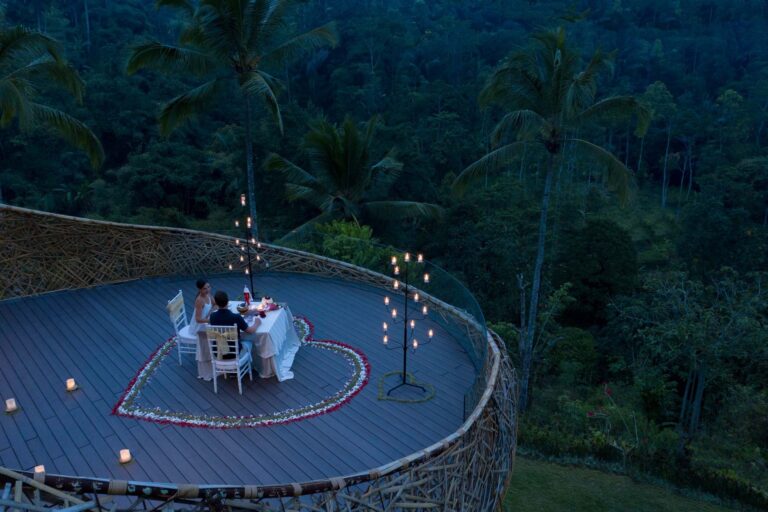 Heart of petals around a dinner table for two on the deck, Padma Resort Ubud
