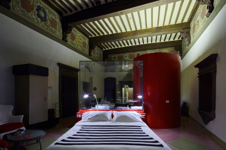 A frescoed-ceiling suite with a red lacquer pod and striped floor, Palazzetto Rosso