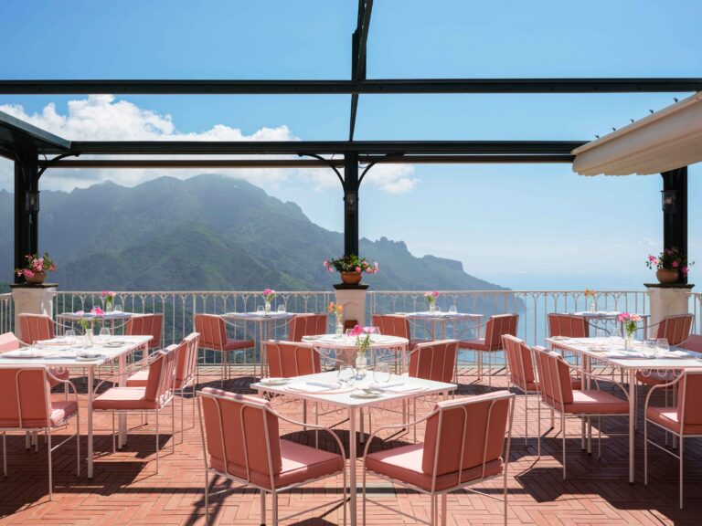 Tables set for dining on the covered terrace, Palazzo Avino
