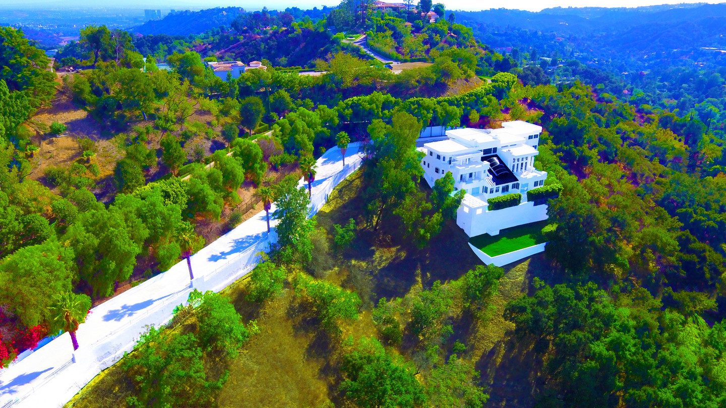 An aerial view of the mansion on its hillside, Palazzo Beverly Hills