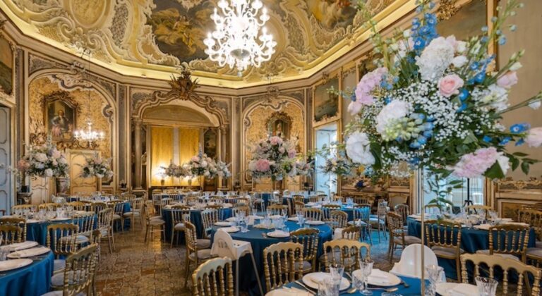 Reception in a frescoed baroque ballroom with blue linens and tall flowers, Panta Rhei Wedding
